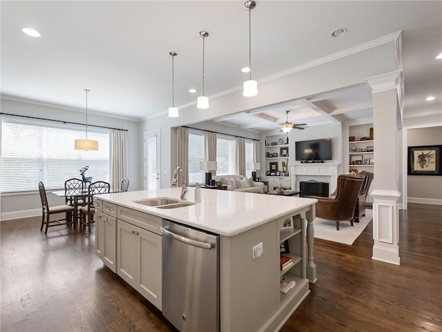 kitchen featuring sink, white cabinetry, hanging light fixtures, a center island with sink, and stainless steel dishwasher