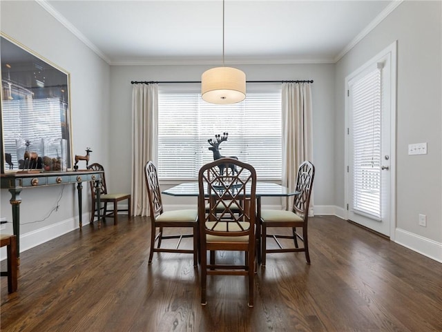 dining room with crown molding and dark hardwood / wood-style floors