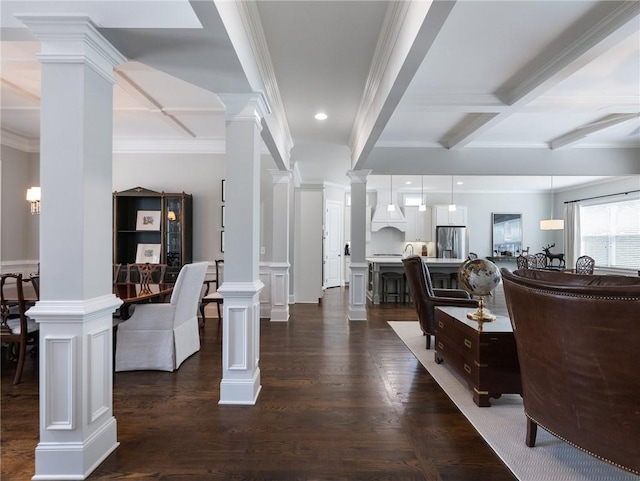 interior space with coffered ceiling, beam ceiling, dark hardwood / wood-style floors, and ornate columns