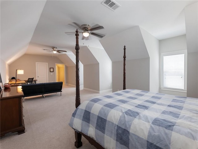 bedroom with ceiling fan, vaulted ceiling, and light carpet