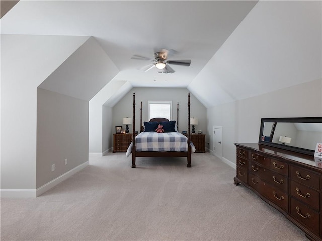 carpeted bedroom featuring lofted ceiling and ceiling fan