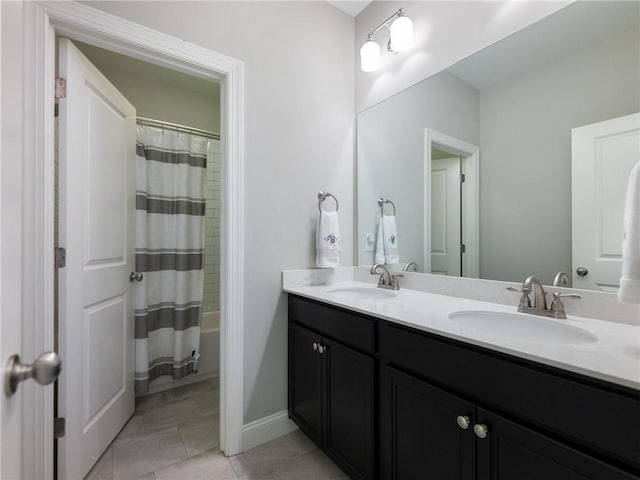 bathroom featuring tile patterned flooring, vanity, and shower / bath combo