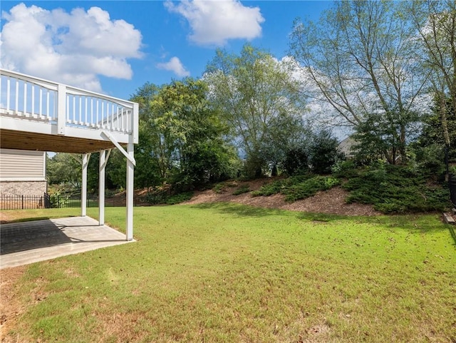 view of yard with a patio and a deck