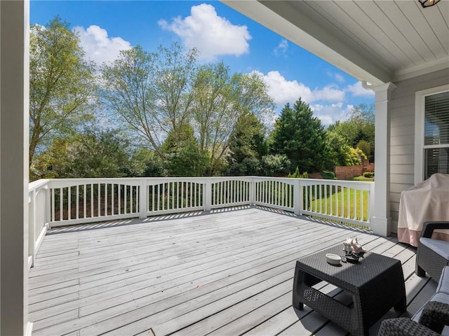 wooden terrace featuring a grill