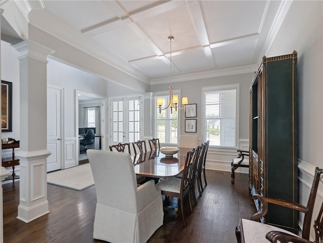 dining area with coffered ceiling, a chandelier, ornamental molding, dark hardwood / wood-style flooring, and decorative columns