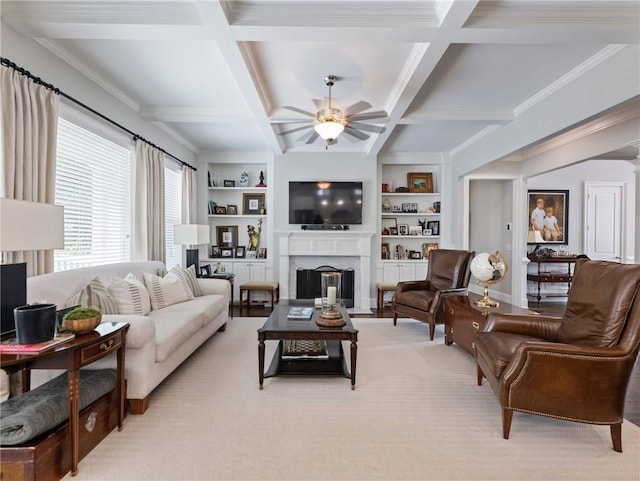 living room with beamed ceiling, ceiling fan, coffered ceiling, and built in features