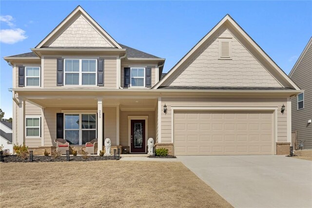 craftsman-style house with a garage and covered porch