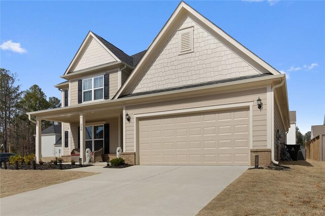 view of front of home featuring a garage and covered porch