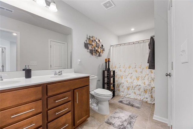 bathroom featuring a shower with curtain, vanity, tile patterned floors, and toilet