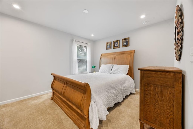 bedroom featuring light colored carpet