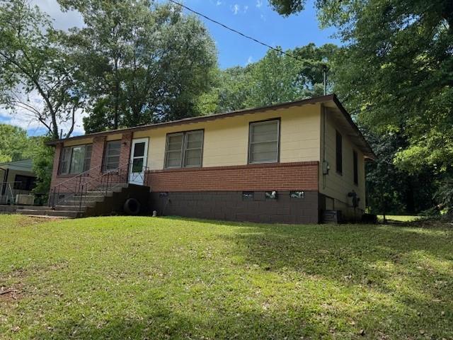 3127 Latona Dr SW, Atlanta, GA 30354 - view of front of property with a front yard, brick siding, and crawl space
