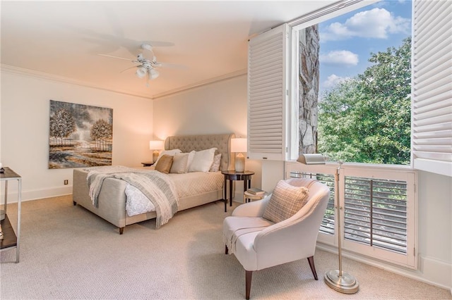 carpeted bedroom featuring multiple windows, crown molding, and ceiling fan