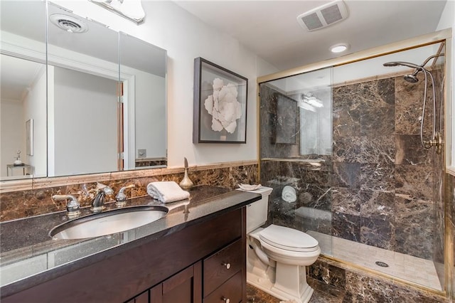 bathroom featuring walk in shower, vanity, toilet, and tile walls