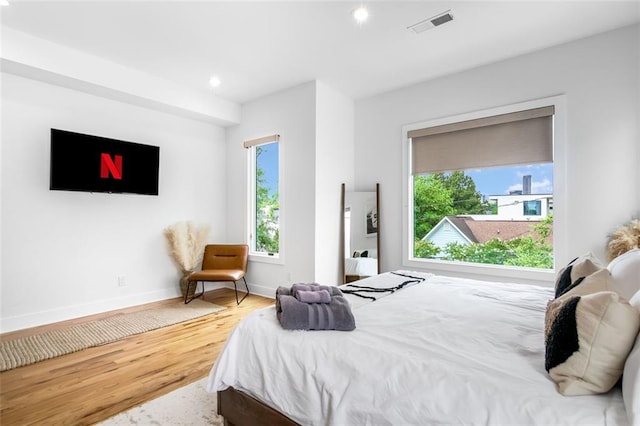 167 Sampson St NE, Atlanta, GA 30312 - bedroom featuring wood finished floors, multiple windows, and recessed lighting