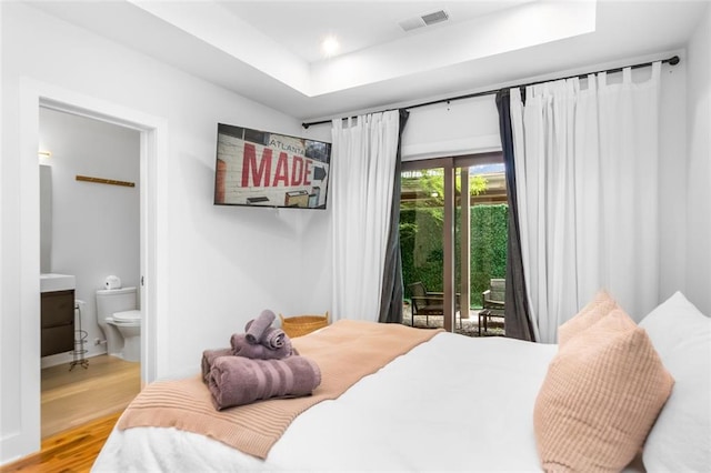 167 Sampson St NE, Atlanta, GA 30312 - bedroom featuring access to outside, wood finished floors, connected bathroom, a raised ceiling, and recessed lighting