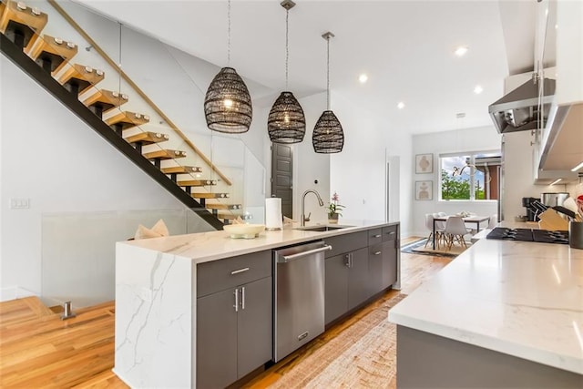 167 Sampson St NE, Atlanta, GA 30312 - kitchen with dishwasher, a kitchen island with sink, light wood finished floors, recessed lighting, and light stone countertops
