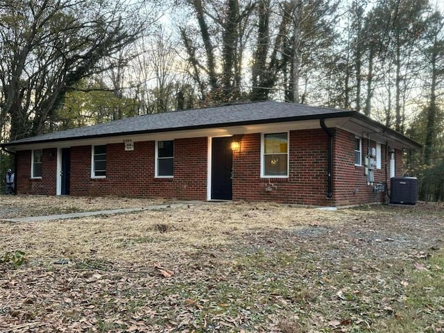 ranch-style house featuring central AC unit