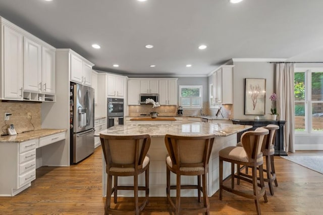 4250 Old Oak Trce, Cumming, GA 30041 - kitchen with stainless steel appliances, decorative backsplash, crown molding, white cabinetry, and recessed lighting