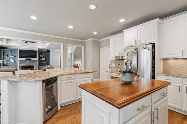 4250 Old Oak Trce, Cumming, GA 30041 - kitchen featuring a kitchen island, beverage cooler, stainless steel fridge with ice dispenser, butcher block counters, and recessed lighting