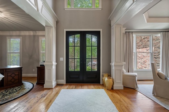 4250 Old Oak Trce, Cumming, GA 30041 - entryway with french doors, light wood-type flooring, decorative columns, and crown molding