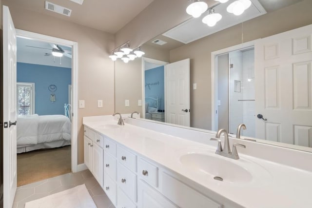 4250 Old Oak Trce, Cumming, GA 30041 - ensuite bathroom featuring double vanity, tile patterned flooring, a shower with door, a ceiling fan, and baseboards