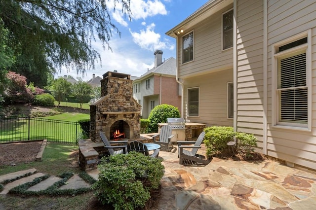 4250 Old Oak Trce, Cumming, GA 30041 - view of patio / terrace featuring an outdoor stone fireplace and grilling area