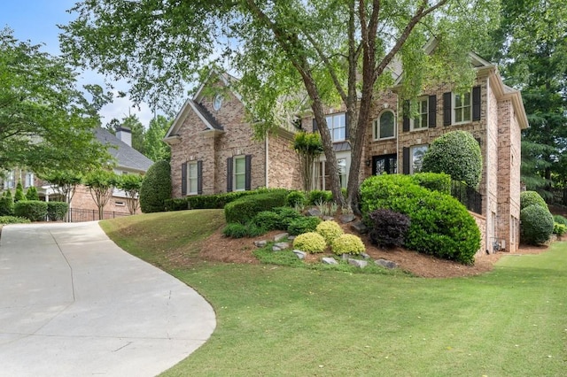 4250 Old Oak Trce, Cumming, GA 30041 - view of front facade with a front yard and brick siding