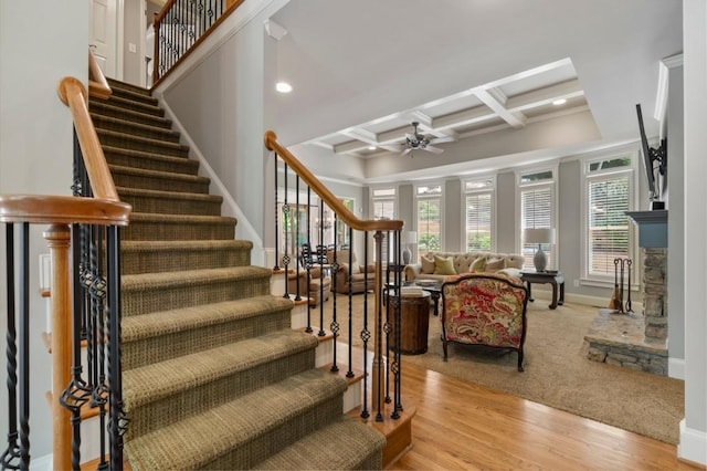 4250 Old Oak Trce, Cumming, GA 30041 - stairs featuring coffered ceiling, ceiling fan, beam ceiling, recessed lighting, and wood finished floors