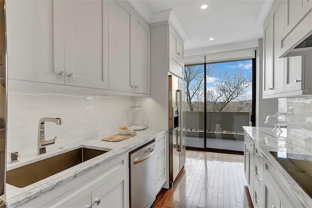 2575 Peachtree Rd NE Unit 11D, Atlanta, GA 30305 - kitchen with white cabinetry, appliances with stainless steel finishes, and custom exhaust hood