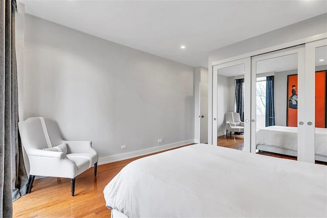 2575 Peachtree Rd NE Unit 11D, Atlanta, GA 30305 - bedroom featuring french doors, wood-type flooring, and a closet