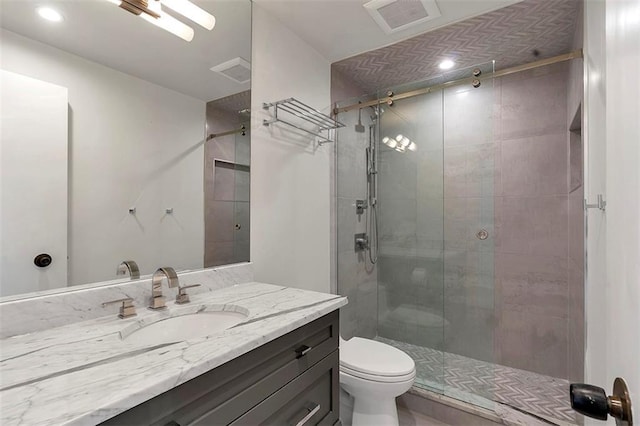 2575 Peachtree Rd NE Unit 11D, Atlanta, GA 30305 - bathroom with walk in shower, vanity, and toilet