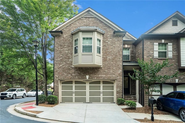 3175 Rock Port Cir, Norcross, GA 30092 - view of front of home featuring brick siding, concrete driveway, and a garage