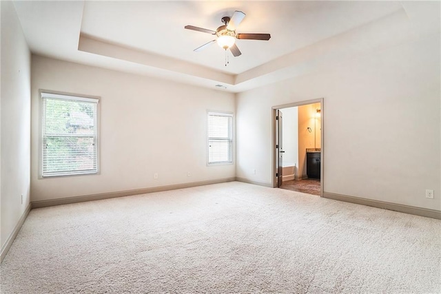 3175 Rock Port Cir, Norcross, GA 30092 - empty room with ceiling fan, carpet flooring, baseboards, and a raised ceiling