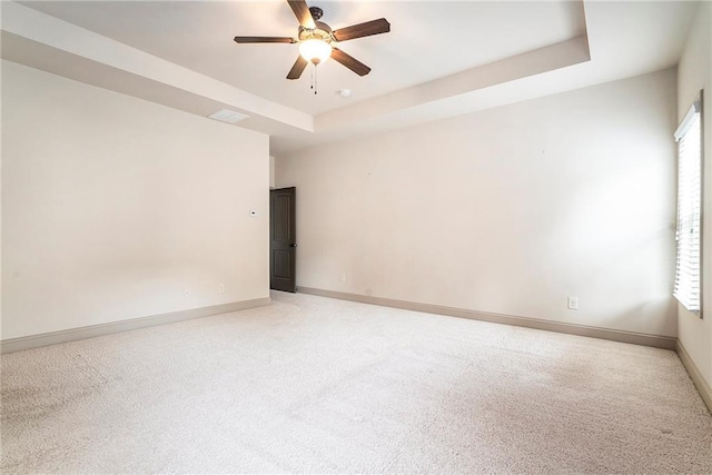 3175 Rock Port Cir, Norcross, GA 30092 - unfurnished room featuring light colored carpet, ceiling fan, a raised ceiling, and baseboards