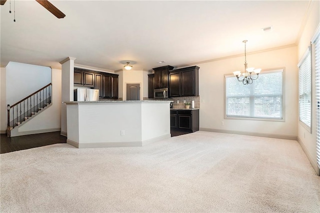 3175 Rock Port Cir, Norcross, GA 30092 - kitchen featuring freestanding refrigerator, stainless steel microwave, carpet flooring, a chandelier, and ceiling fan