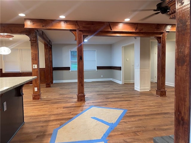 1321 Earle Ct SE, Conyers, GA 30013 - basement with wood finished floors, ceiling fan, recessed lighting, wainscoting, and a barn door
