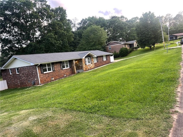 1321 Earle Ct SE, Conyers, GA 30013 - ranch-style house with brick siding, a front yard, and crawl space