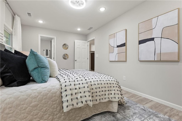 1770 Atherton Dr, Decatur, GA 30035 - bedroom featuring wood finished floors, recessed lighting, and baseboards