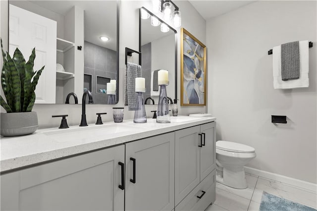 1770 Atherton Dr, Decatur, GA 30035 - bathroom featuring marble look tiles, baseboards, double vanity, toilet, and recessed lighting