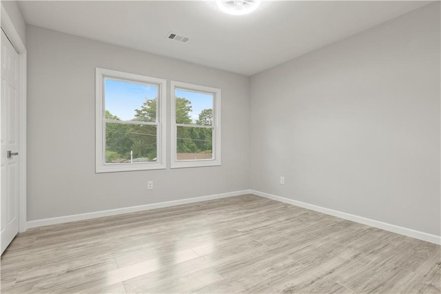 1770 Atherton Dr, Decatur, GA 30035 - unfurnished bedroom with light wood finished floors, baseboards, and a closet