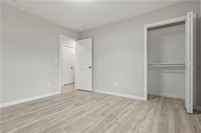 1770 Atherton Dr, Decatur, GA 30035 - unfurnished bedroom featuring light wood finished floors, a closet, and baseboards