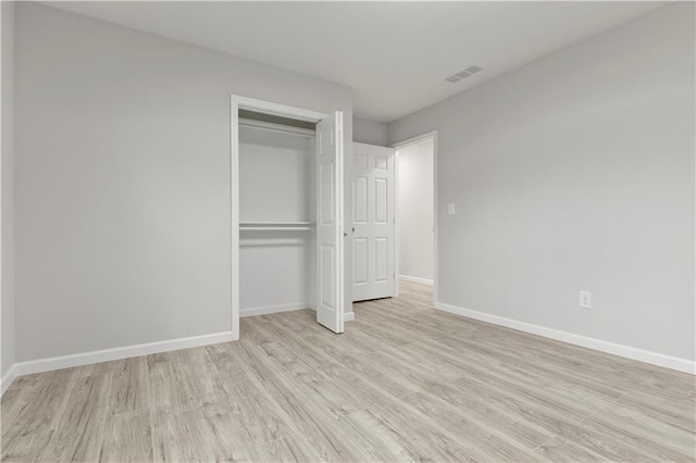 1770 Atherton Dr, Decatur, GA 30035 - unfurnished bedroom with light wood-style flooring, baseboards, and a closet
