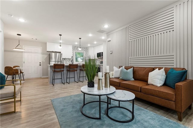 1770 Atherton Dr, Decatur, GA 30035 - living room featuring recessed lighting, light wood-style floors, and baseboards