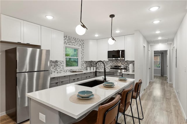 1770 Atherton Dr, Decatur, GA 30035 - kitchen with appliances with stainless steel finishes, a sink, backsplash, light countertops, and recessed lighting