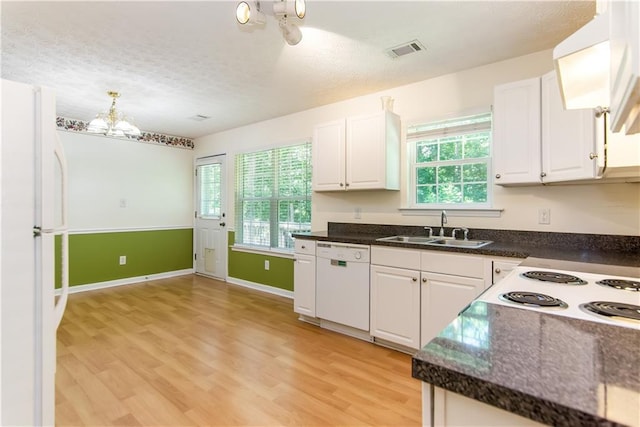 24 Arrow Ct, Lavonia, GA 30553 - kitchen with white appliances, a chandelier, light wood finished floors, white cabinetry, and healthy amount of natural light