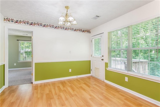 24 Arrow Ct, Lavonia, GA 30553 - spare room featuring a chandelier and light wood-style floors