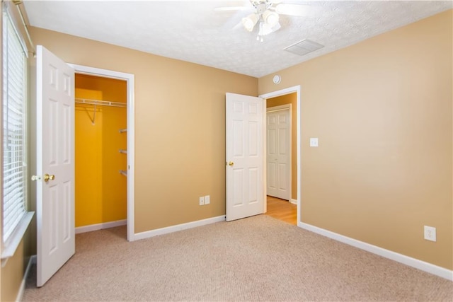 24 Arrow Ct, Lavonia, GA 30553 - unfurnished bedroom featuring light carpet, a ceiling fan, a textured ceiling, and a closet