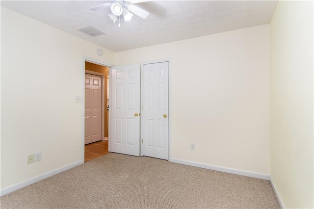 24 Arrow Ct, Lavonia, GA 30553 - unfurnished bedroom with light carpet and ceiling fan