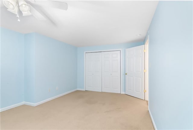 24 Arrow Ct, Lavonia, GA 30553 - unfurnished bedroom with light colored carpet, a closet, and a ceiling fan