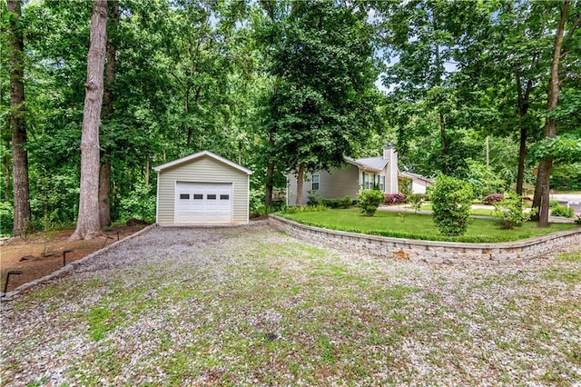 24 Arrow Ct, Lavonia, GA 30553 - view of front of property with an outbuilding, a garage, gravel driveway, and a front lawn